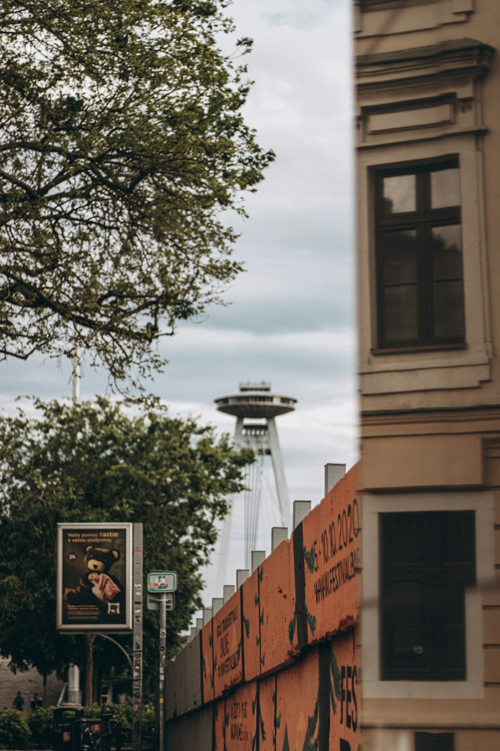 a tall building with a tower in the background