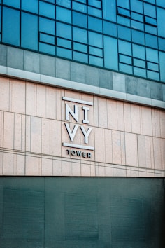 a tall building with a sign on the side of it