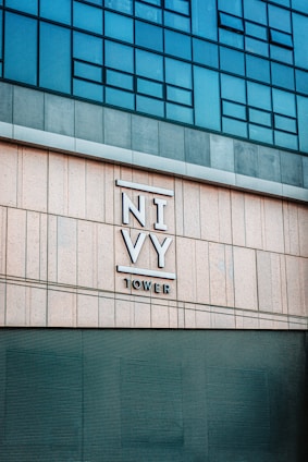 a tall building with a sign on the side of it