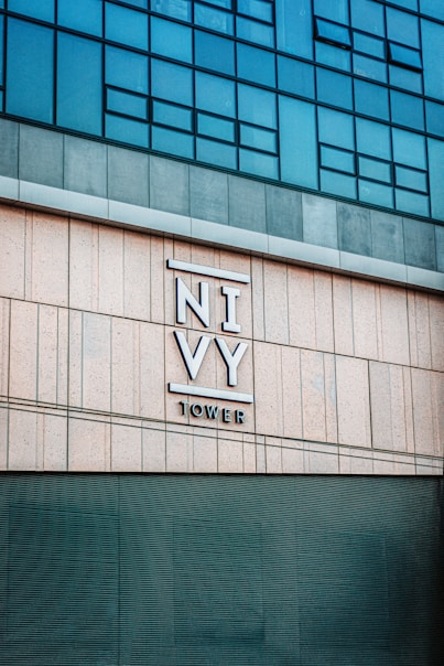 a tall building with a sign on the side of it