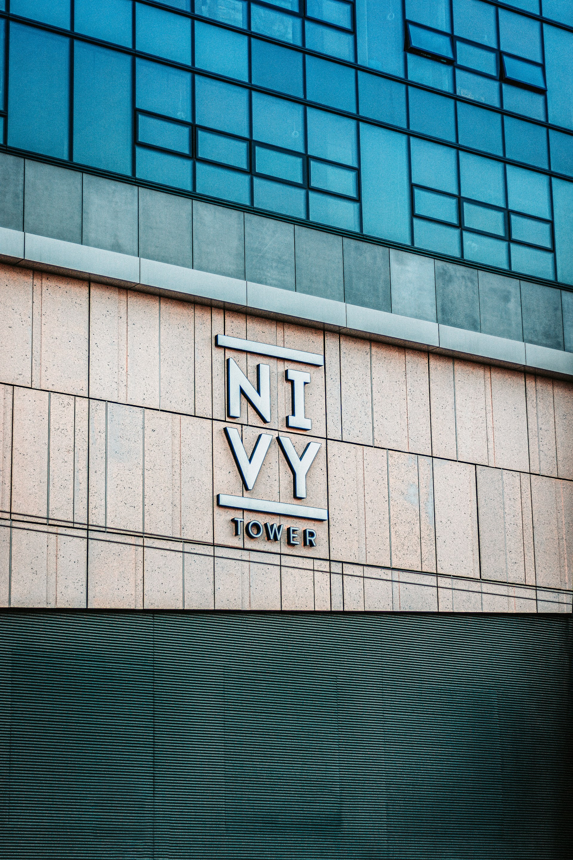 a tall building with a sign on the side of it