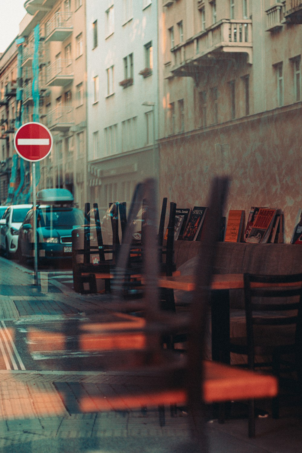 a row of tables and chairs on a city street