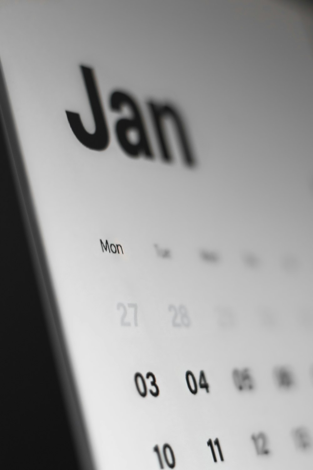 a black and white photo of a calendar