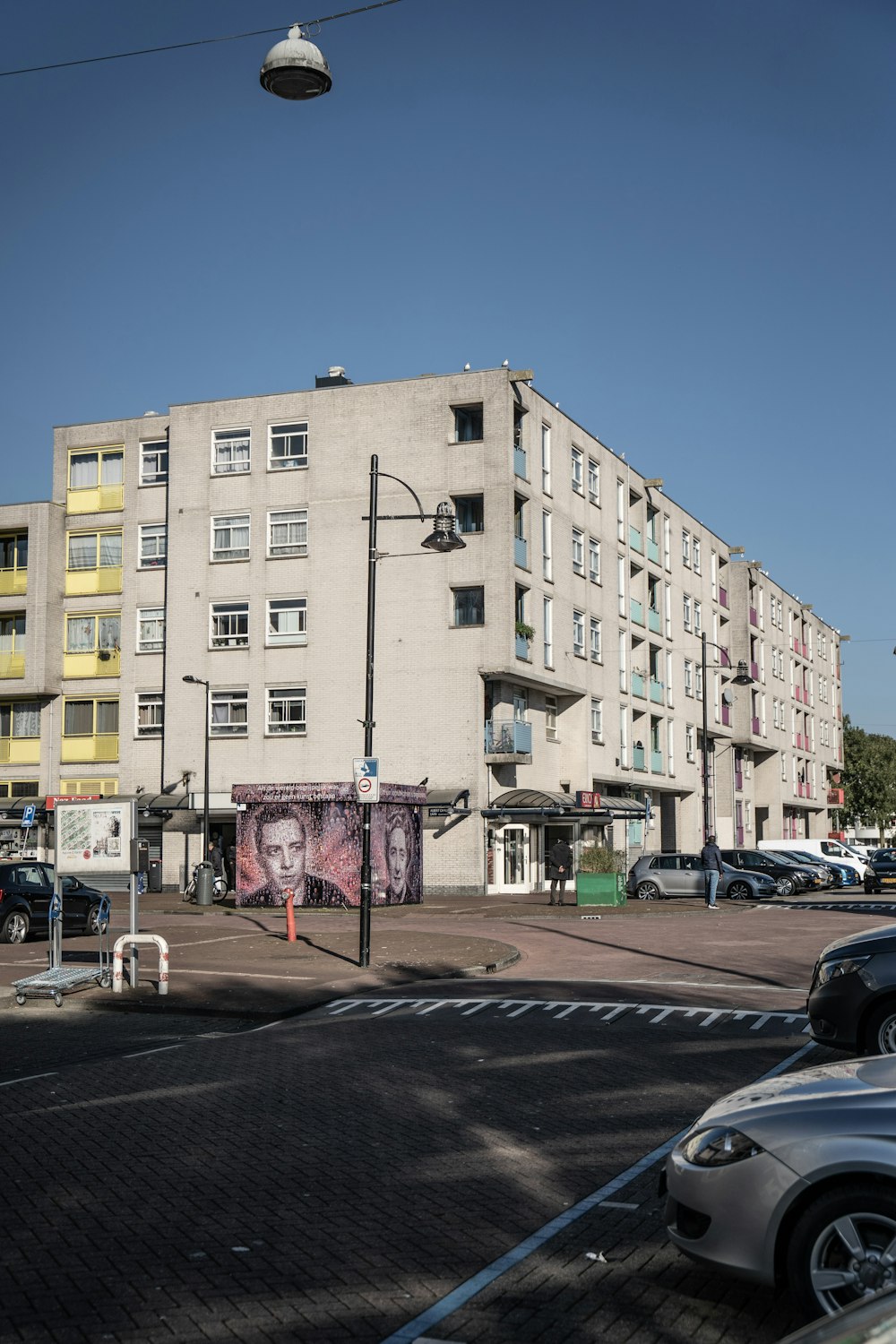 a large white building sitting on the side of a road