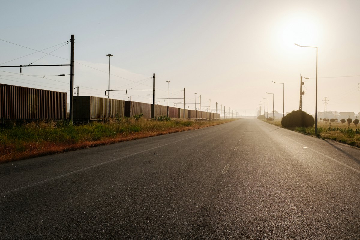 Empty road at sunrise on the drive home after a night shift — Monday blessings for night shift workers
