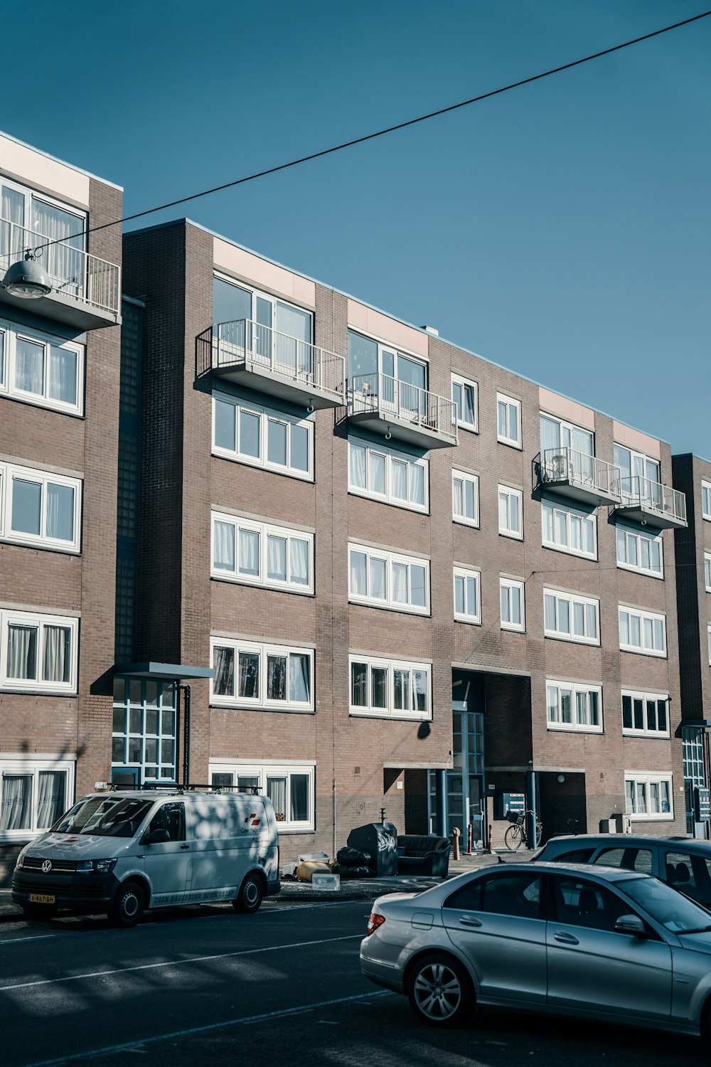 a large brick building with many windows and balconies