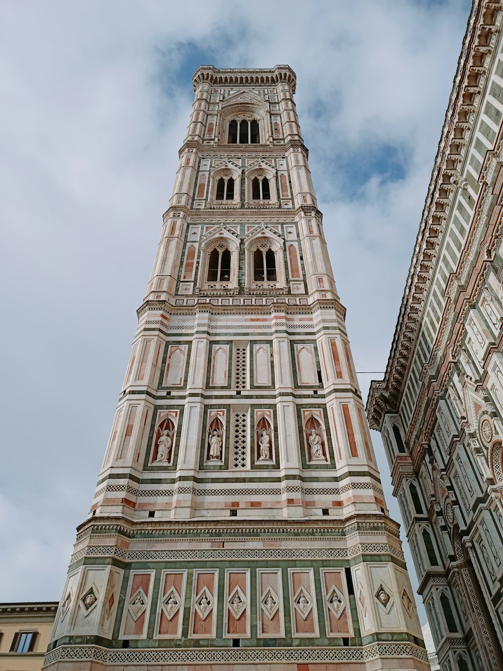 a very tall building with a clock on it's side