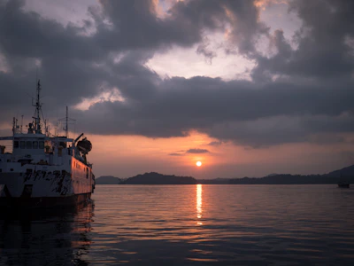 a large boat floating on top of a body of water