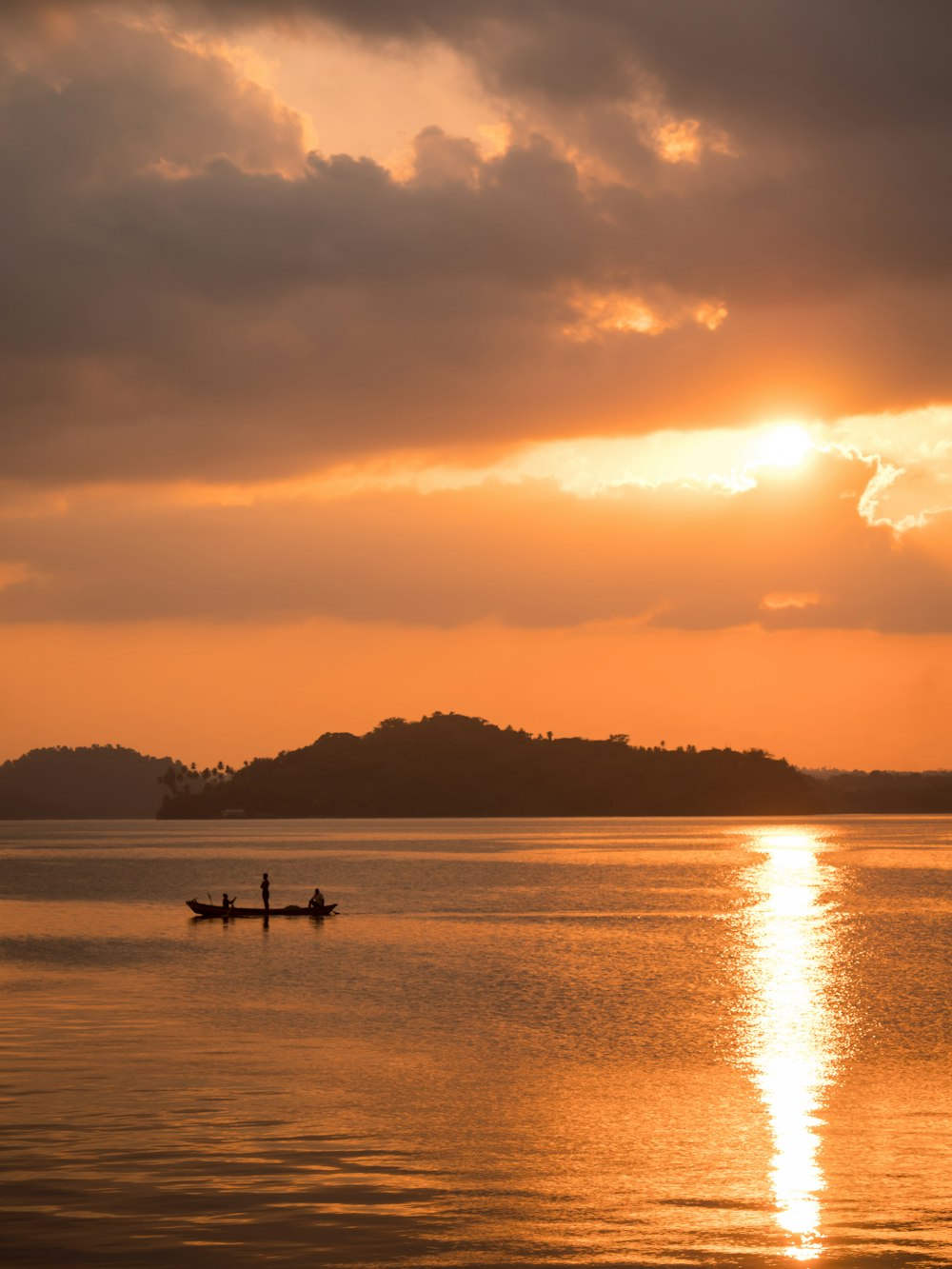 a couple of people in a boat on a body of water