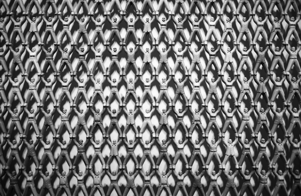 a black and white photo of a metal surface