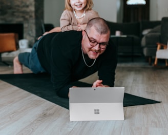 a man and a little girl doing online Personal Training
