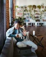 A cheerful user enjoying a casual game on a tablet in a cozy setting.