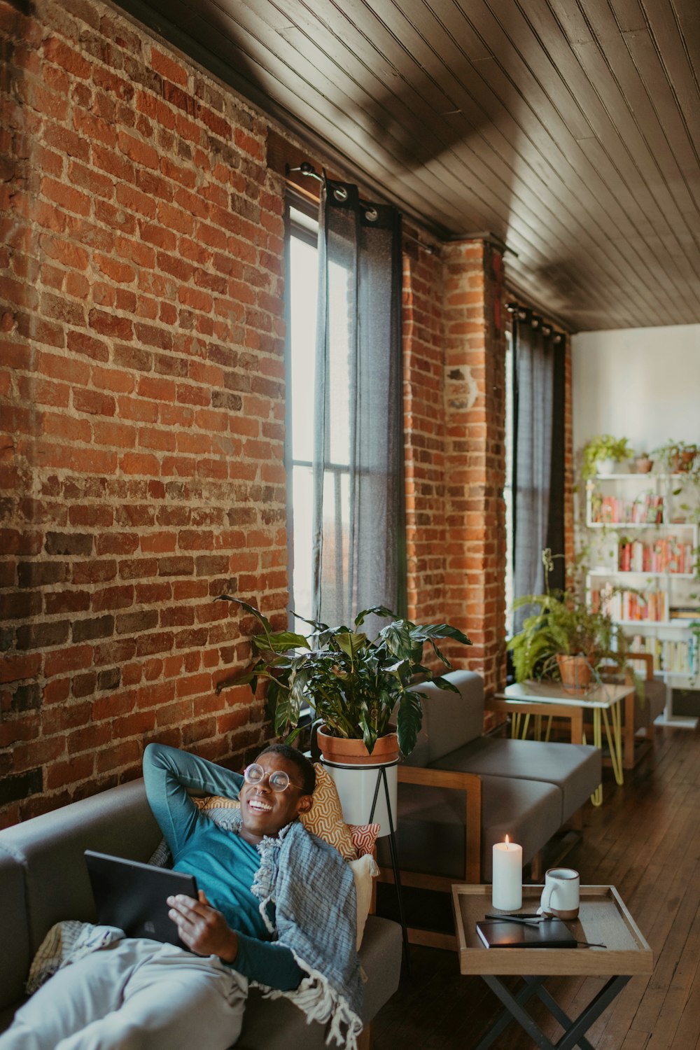 a person laying on a couch in a room