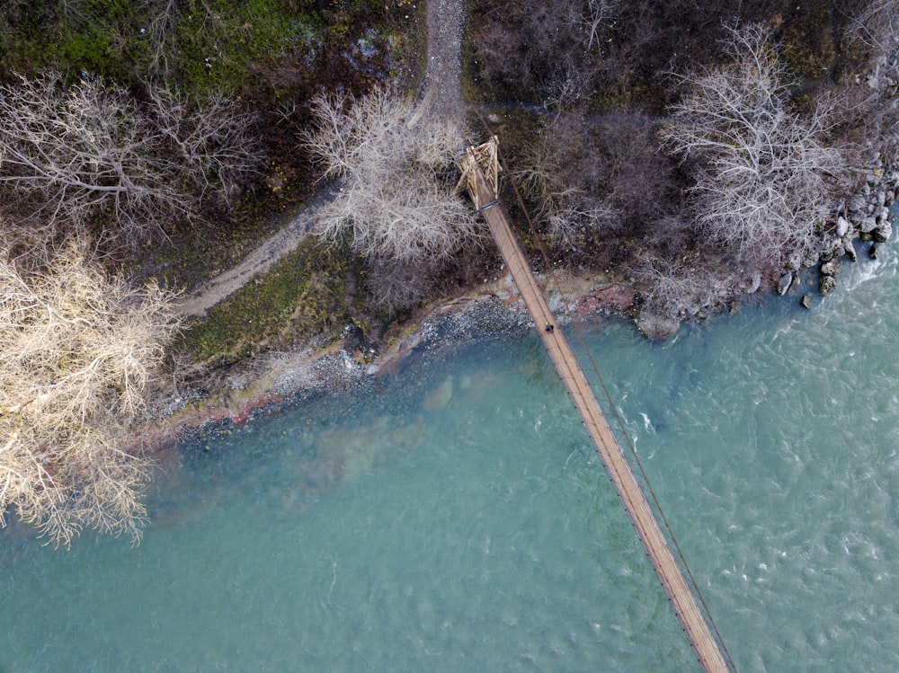 an aerial view of a bridge over a river