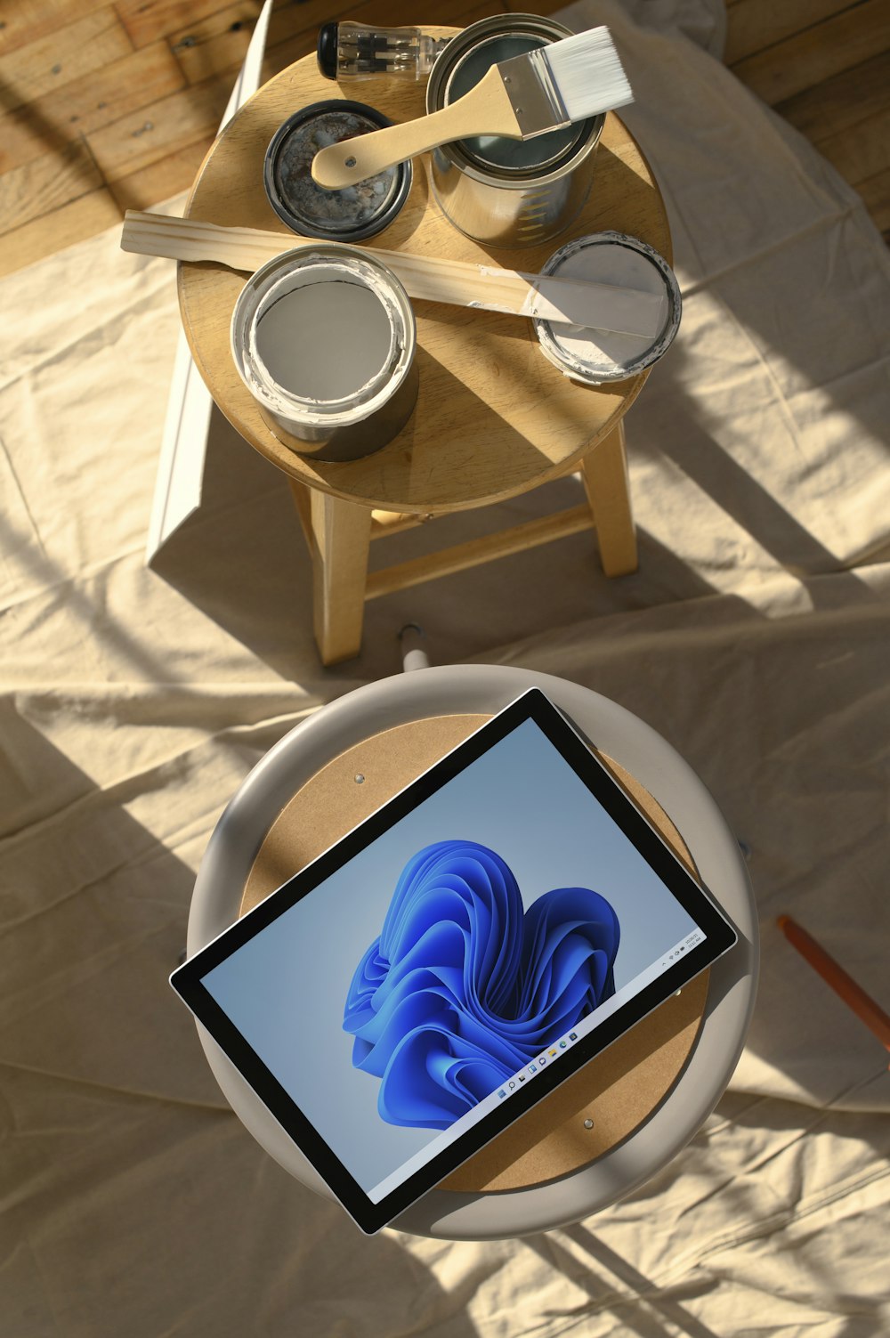 a tablet computer sitting on top of a wooden table