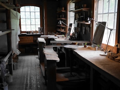 a room filled with lots of clutter and lots of windows