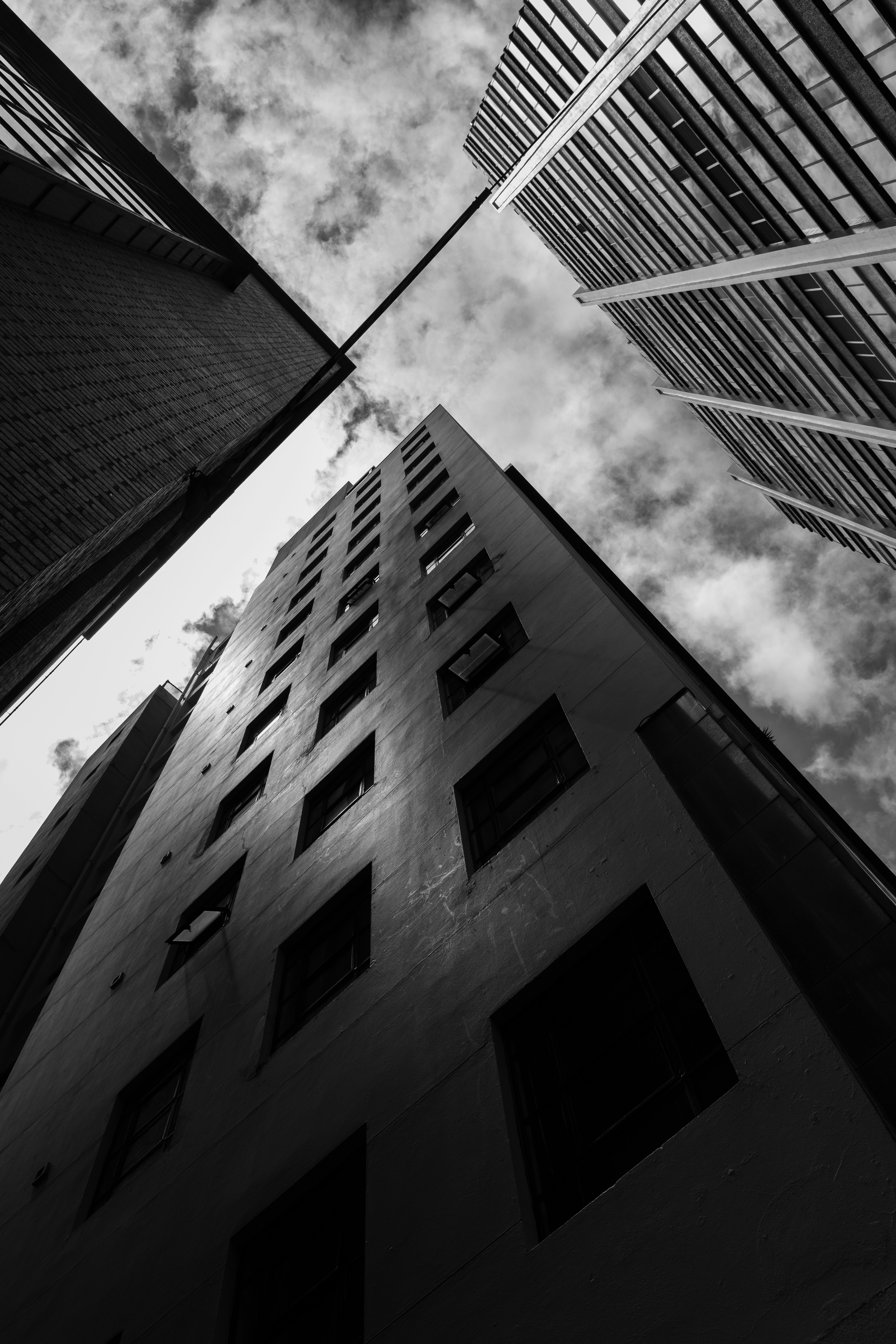 a black and white photo of tall buildings