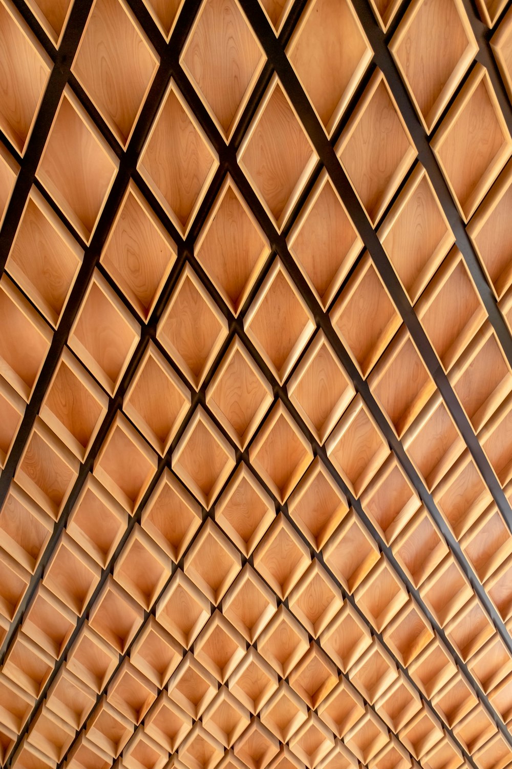 a ceiling made of wooden planks in a building