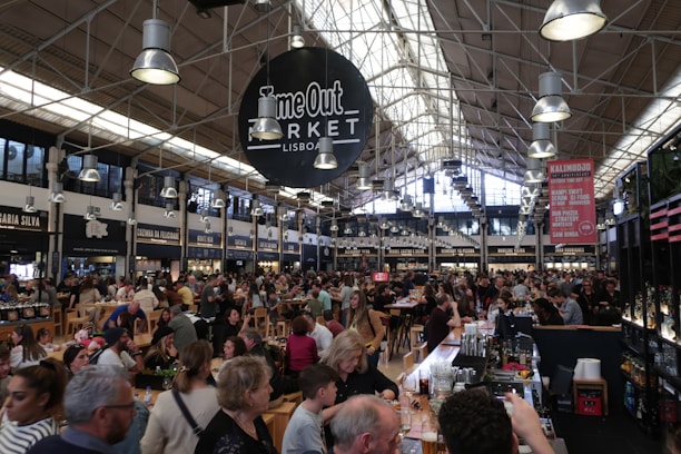 A vibrant promotional video still of a bustling Manchester restaurant filmed by drone.