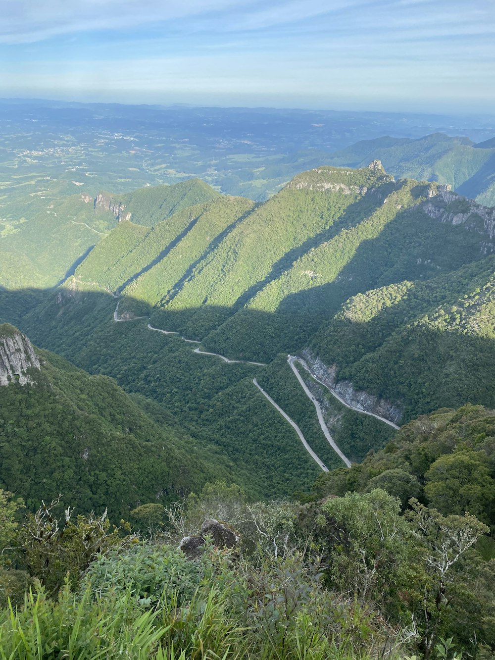 a view of a winding road in the mountains