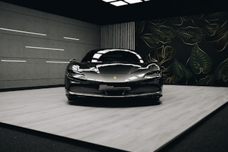 a black sports car parked in a garage