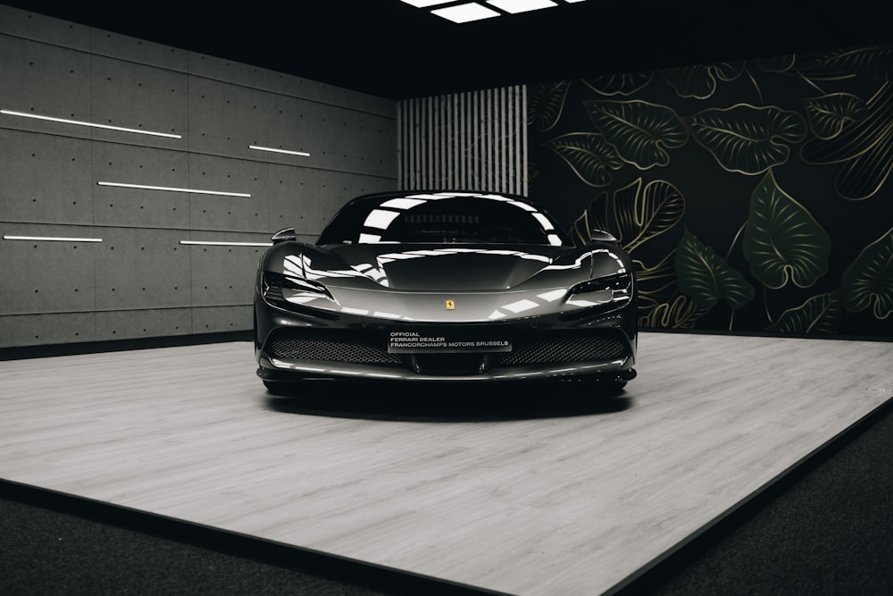 a black sports car parked in a garage