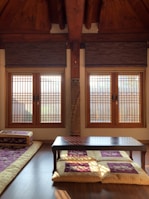 Spacious room featuring Hindu motifs, a comfortable bed, and views of temple grounds.