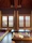 A cozy room with traditional decor at Sanskriti Stay, sunlight streaming through the window.