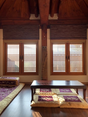 Cozy room with traditional Indian decor and a view of a nearby temple.