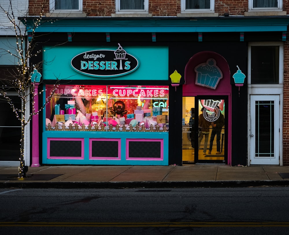 a store front with a neon green and pink window