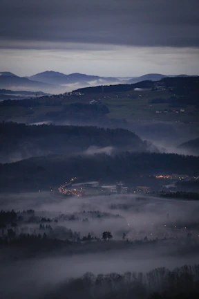 Atmospheric landscape from an open-world adventure game at dusk.