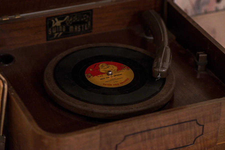 A vintage record player, spinning a Christmas record.