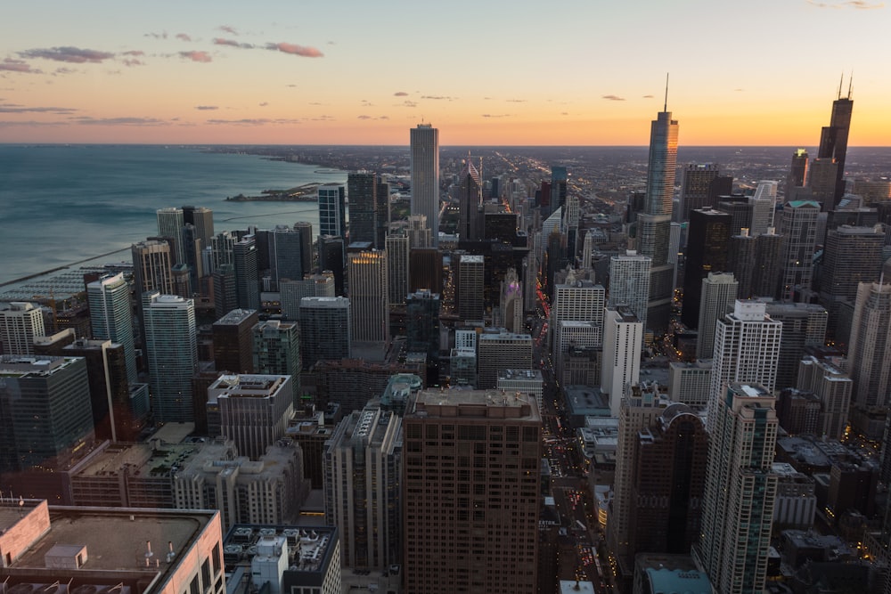 an aerial view of a city at sunset