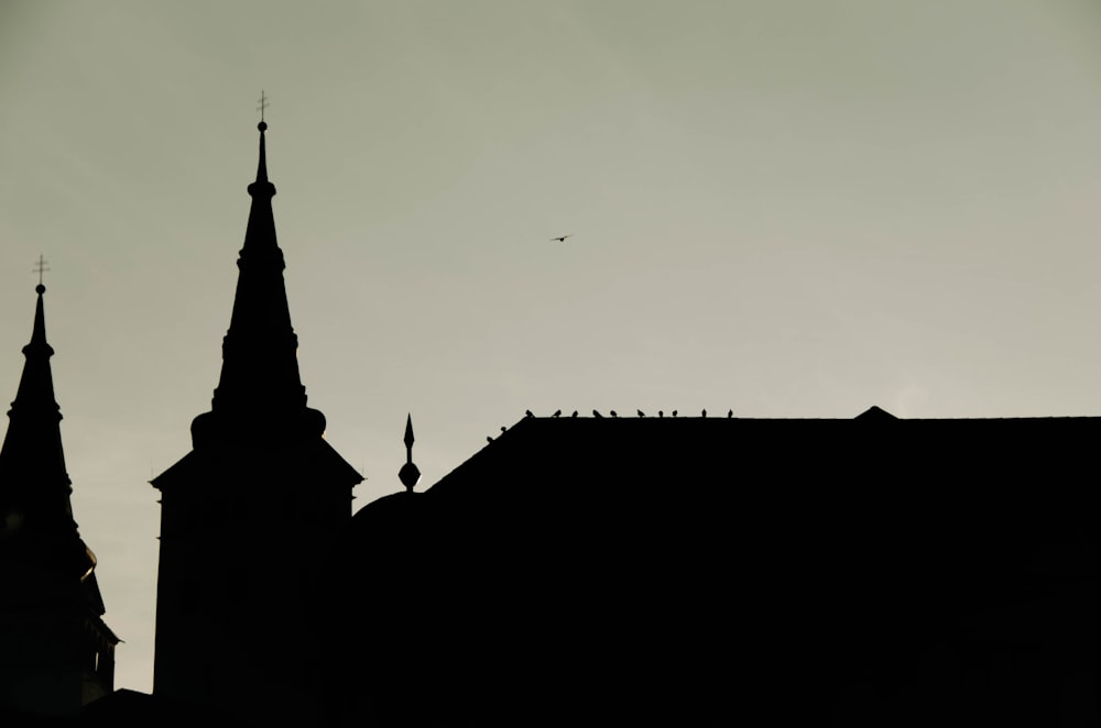 a black and white photo of a church steeple