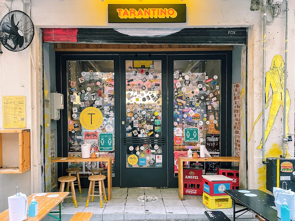 a store front with a lot of stickers on it