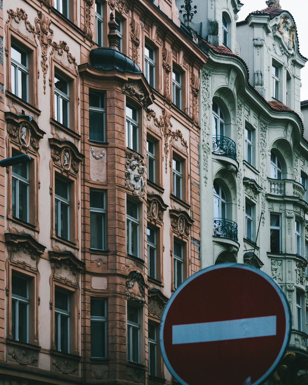 a close up of a street sign in front of a building