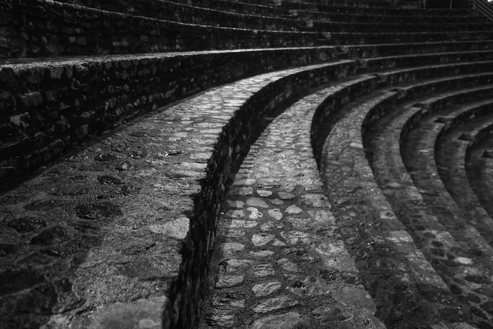 a black and white photo of a stone amphit