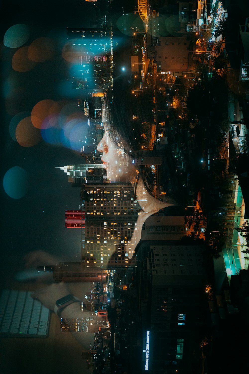 a woman's face in the middle of a city at night