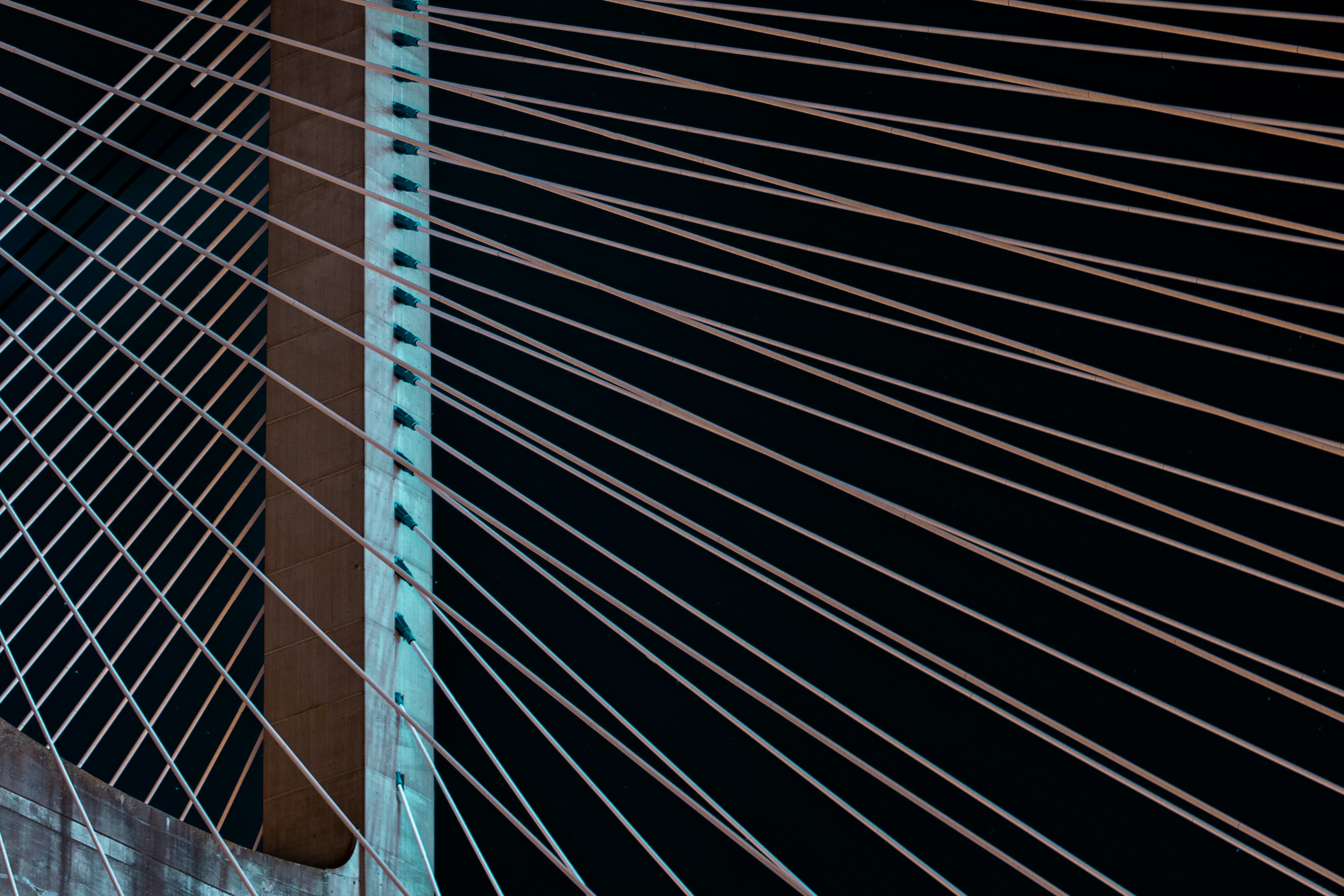 a close up of a very tall bridge at night