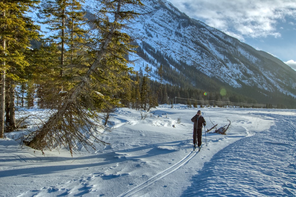 a person cross country skiing in the mountains