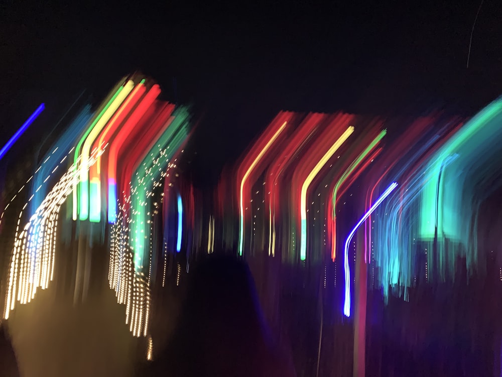 a blurry photo of colorful lights in the dark