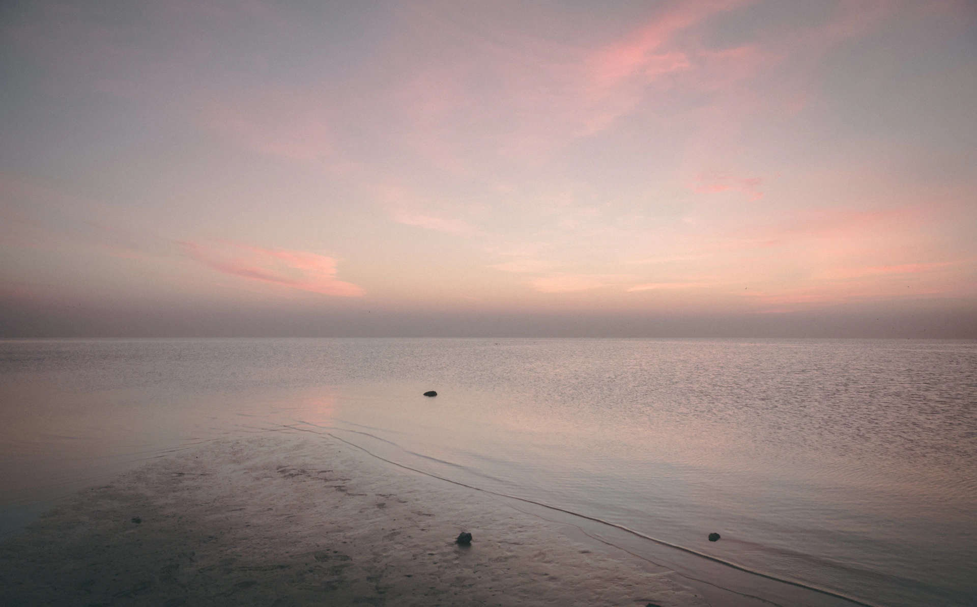 a body of water with a boat in the distance