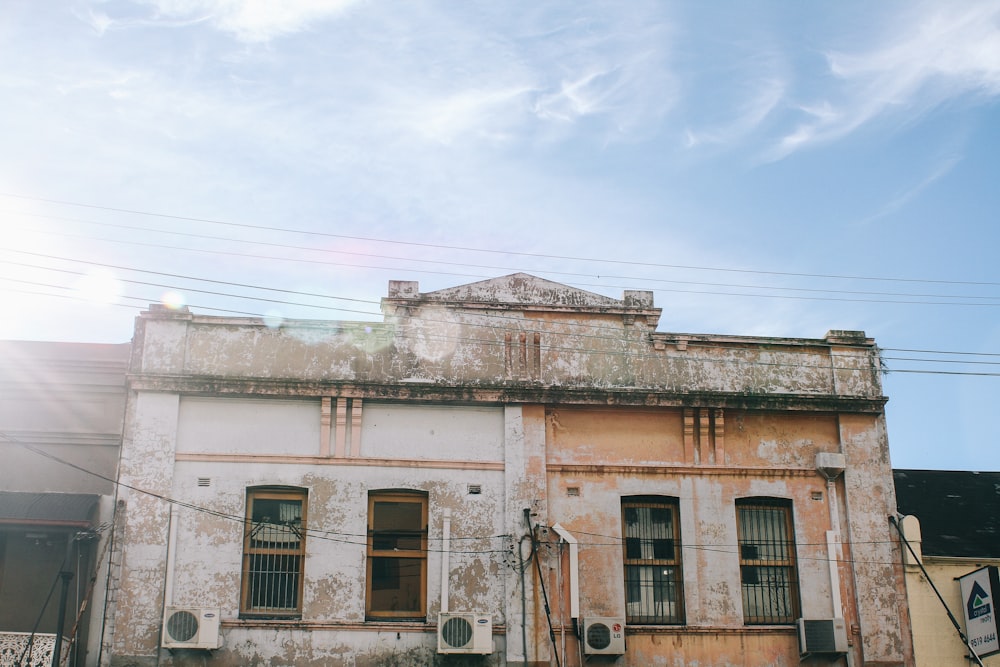 a run down building with a sky background