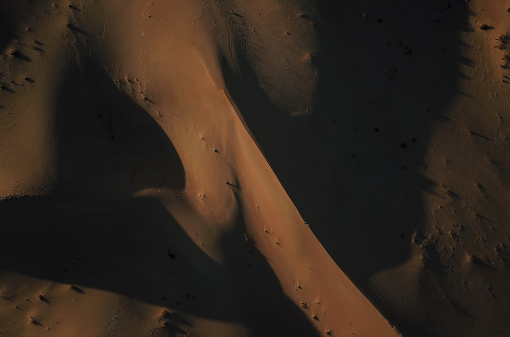 an aerial view of sand dunes in the desert