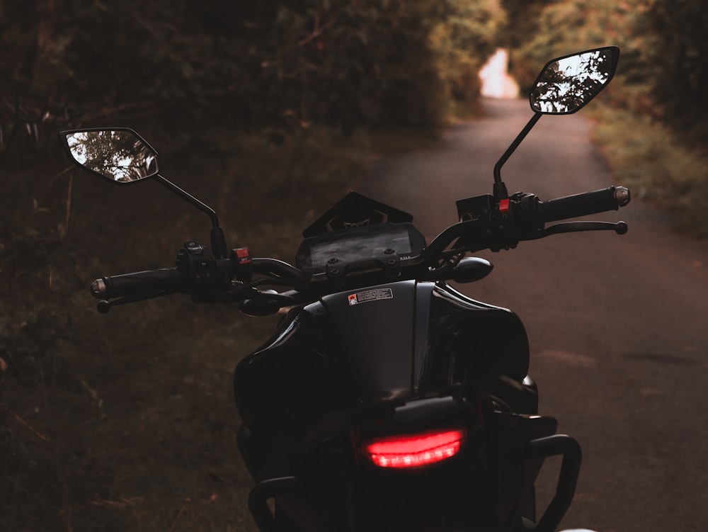 a motorcycle parked on the side of a road