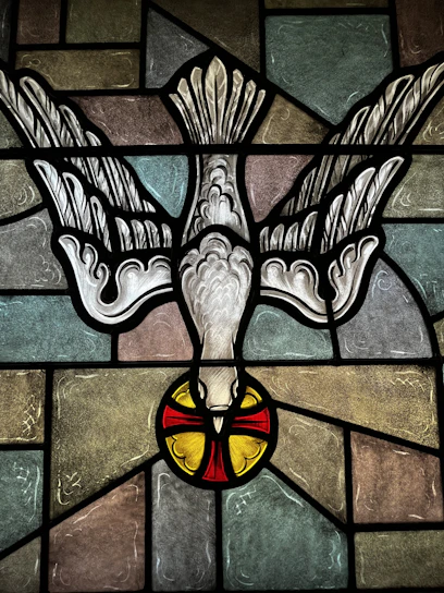 A serene image of a glowing dove descending over an open Bible, symbolizing the Holy Spirit's presence.