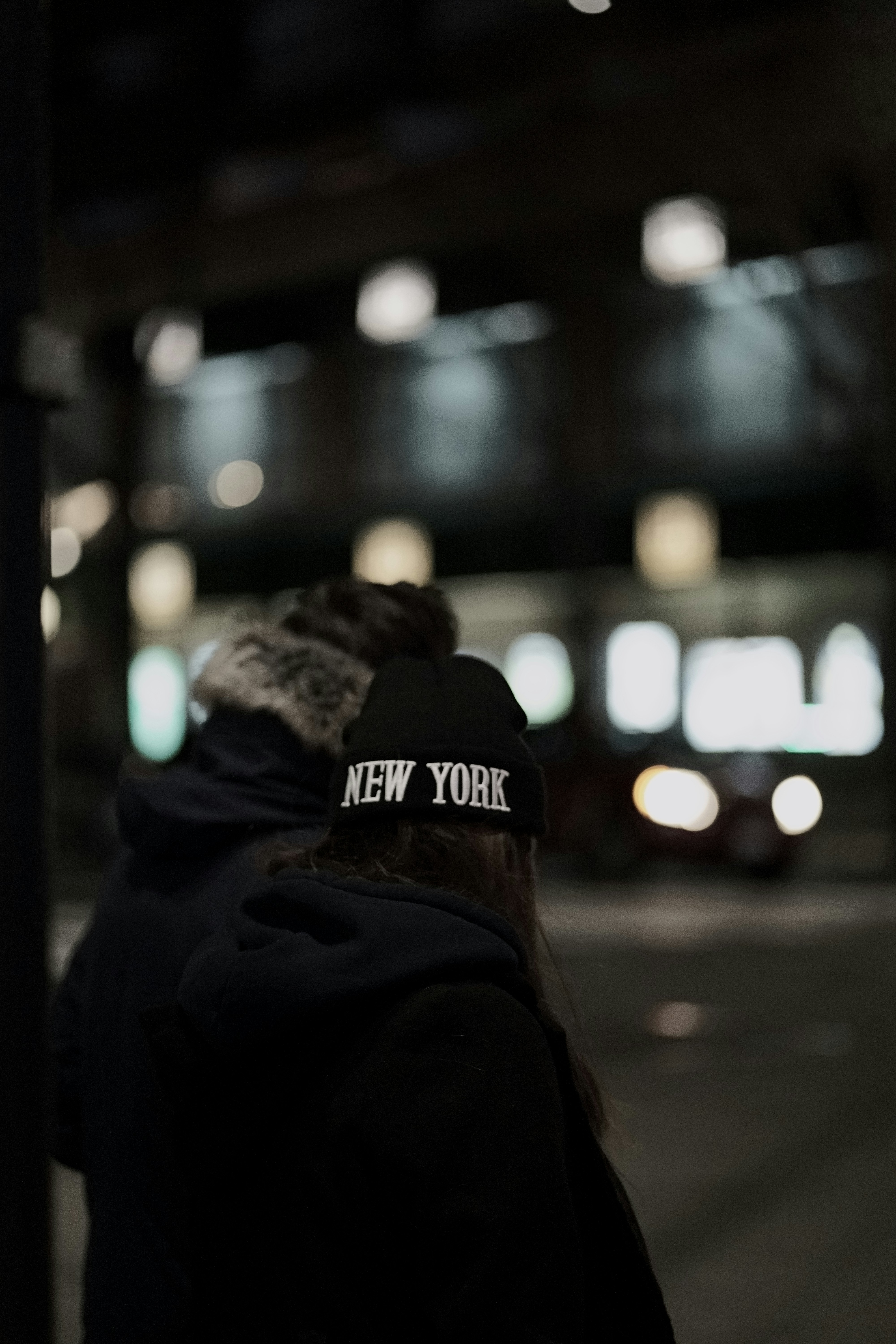 Model wearing luxury streetwear in gritty urban setting