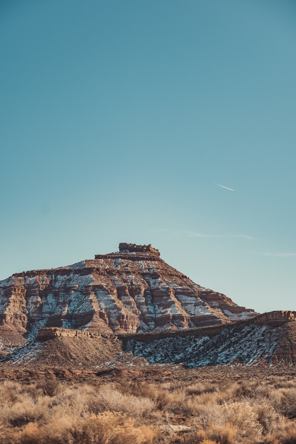 a mountain in the distance with a sky background