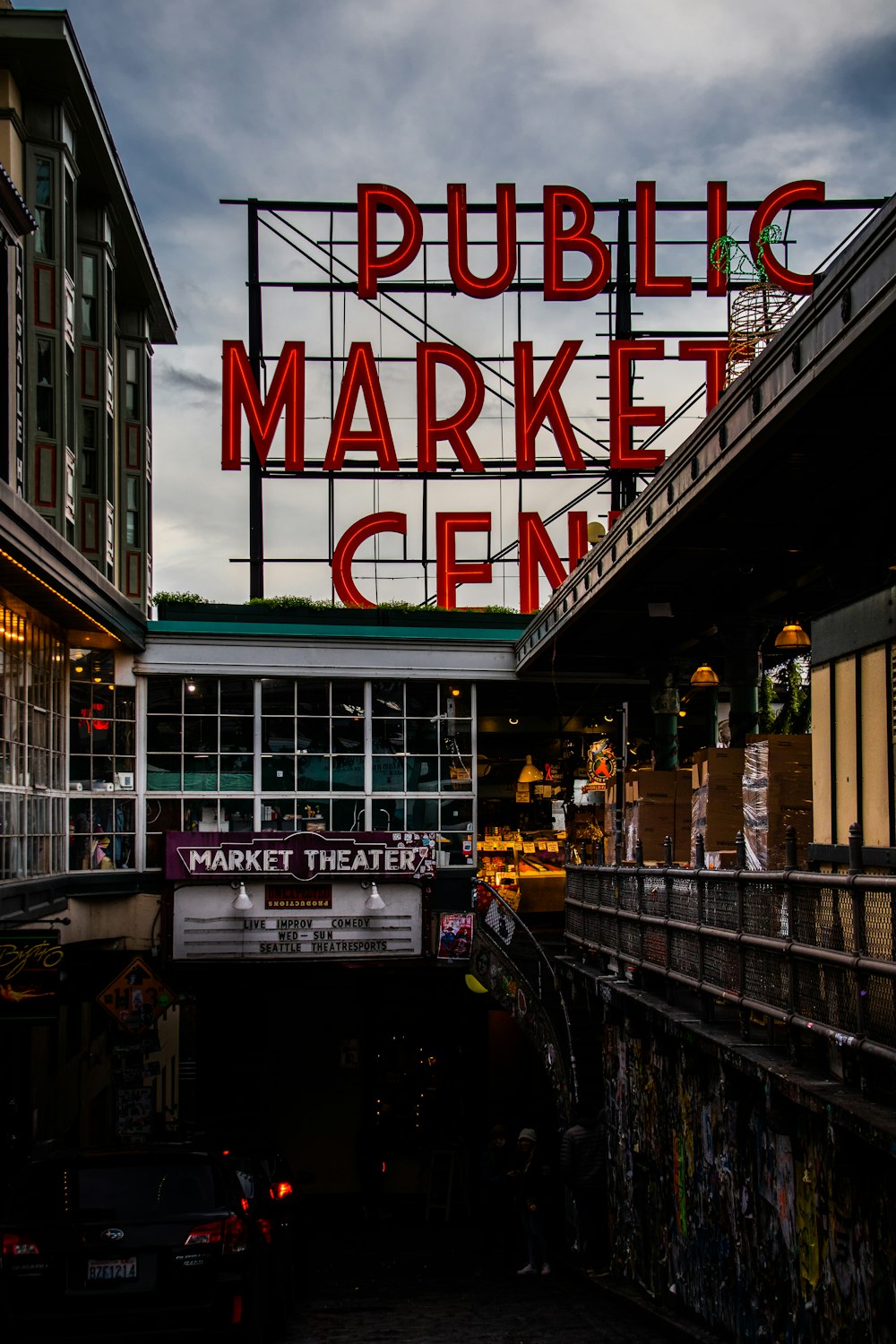 a large neon sign that reads public market center