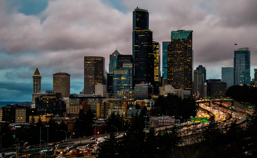 a view of a city at night from a hill